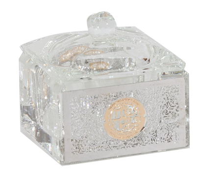 Decorative crystal box with intricate designs and a gold emblem on a white background - AFH Bargains