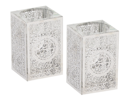 Two silver metal candle holders with intricate designs on a white background - AFH Bargains