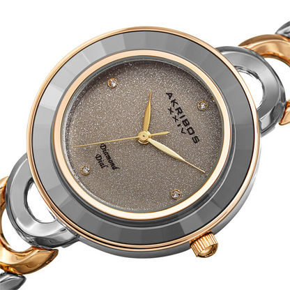 Akribos XXIV Ion Plated Two Tone Silver and Gold Watch with Grey Faceted Crystal on the Case, Silver Glitter Dial and Diamond Markers