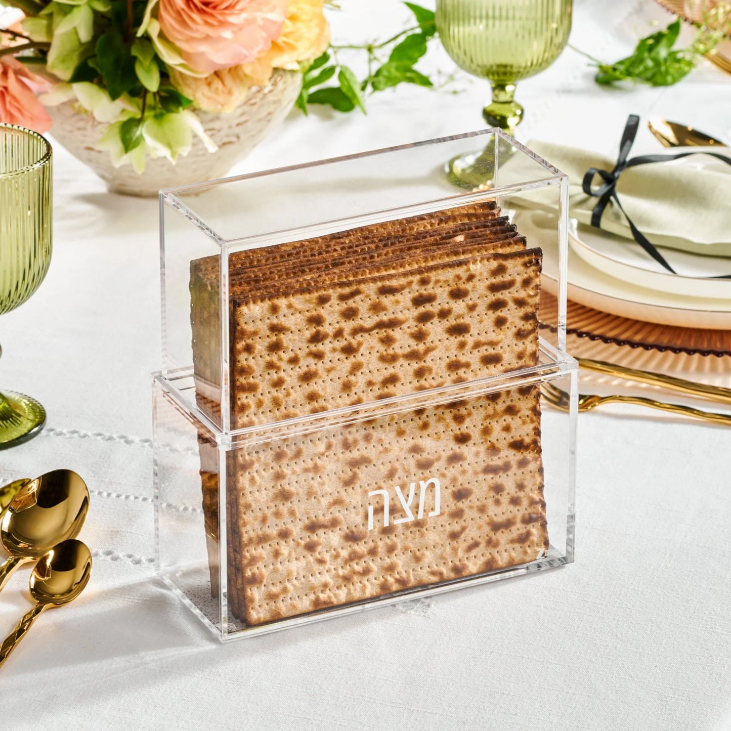 Clear acrylic box with matzah and 'matzah' text on a festive table setting - AFH Bargains