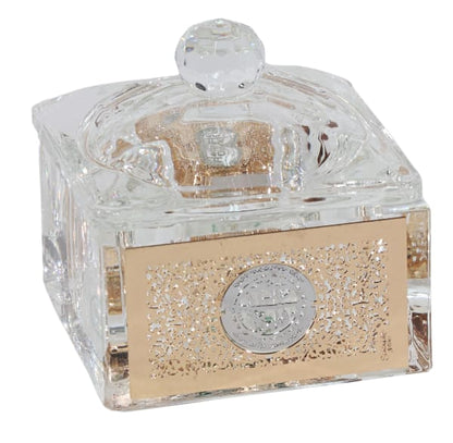 Clear Crystal container with gold accents and a silver emblem on a white background - AFH Bargains